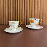 luxury bone china teacup and saucer set floral pattern with full gold handle elegant red & blue options for afternoon  coffee