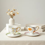 luxury bone china teacup and saucer set floral pattern with full gold handle elegant red & blue options for afternoon  coffee